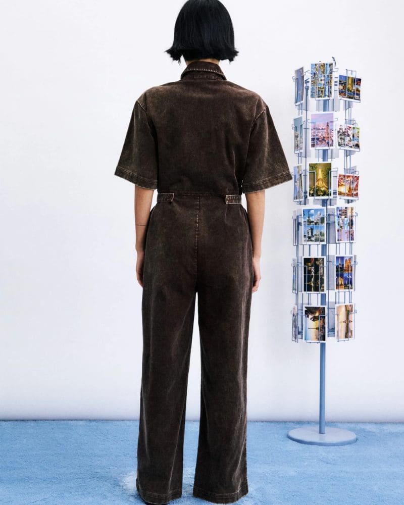 Back view of MARGATE mustard cotton jumpsuit with defined waist and full-length legs