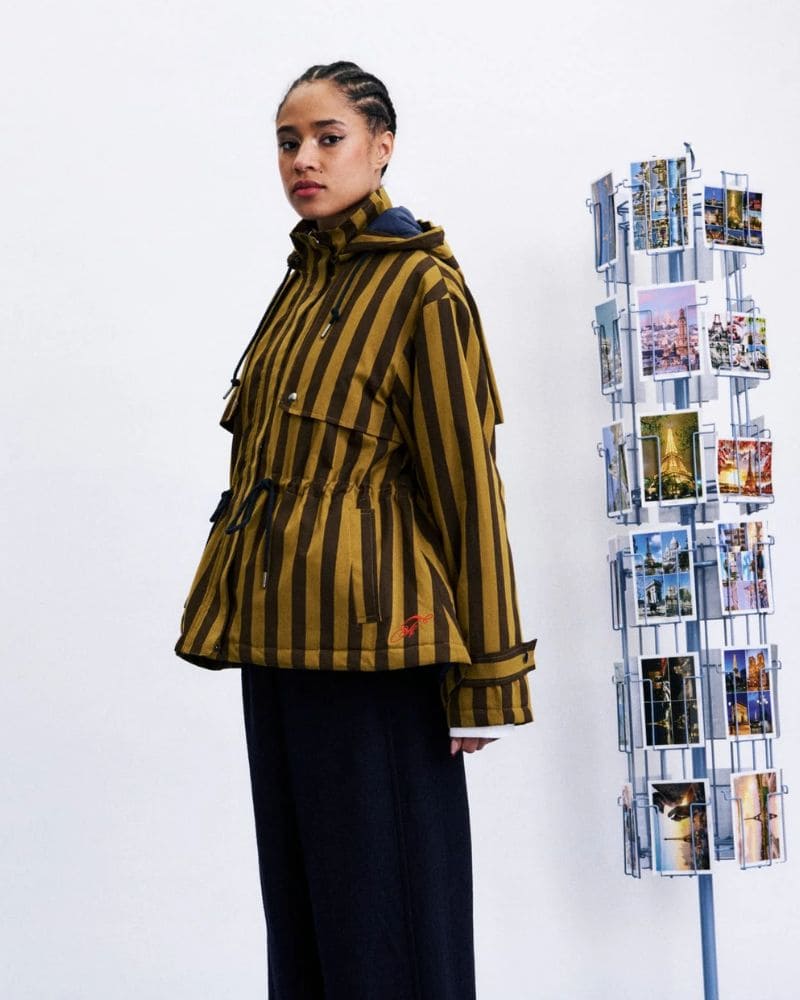 Side view of FRNCH CATBELLS olive hooded jacket with fitted drawstring waist