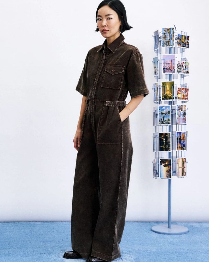 Side view of MARGATE mustard cotton jumpsuit with wide leg and front pockets