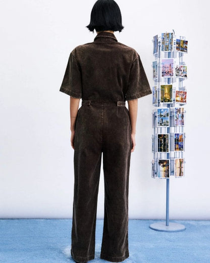 Back view of MARGATE mustard cotton jumpsuit with defined waist and full-length legs