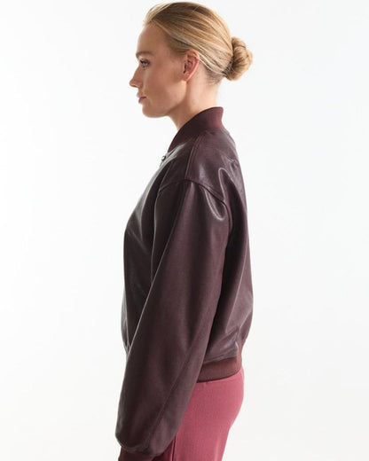 Side view of the Bian wine red leather look bomber jacket